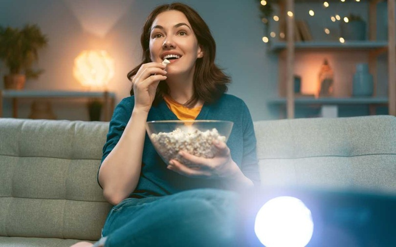 women use nebula 4k projector watching tv