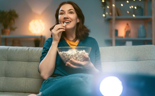 women use nebula 4k projector watching tv